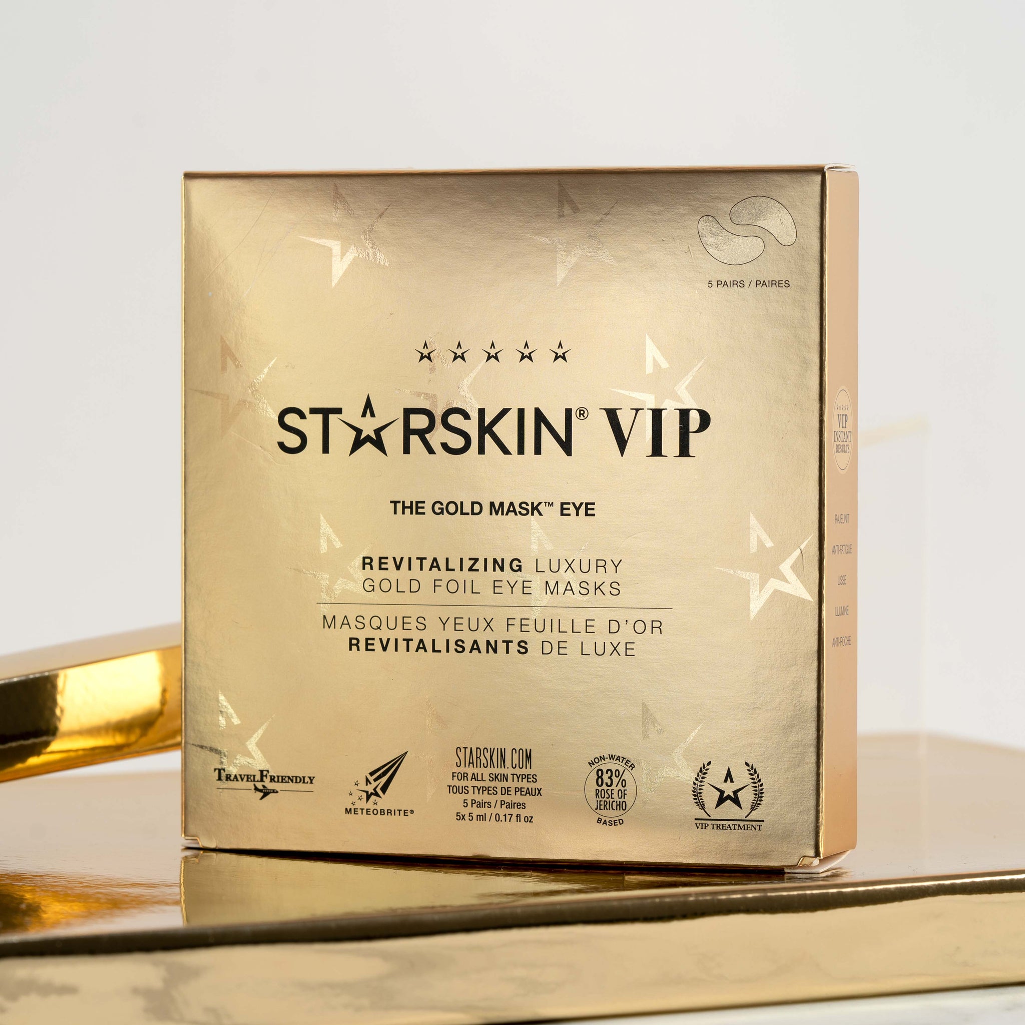 Starskin Gold Mask - eye product packaging in the middle of the image. The product is being displayed in a gold box