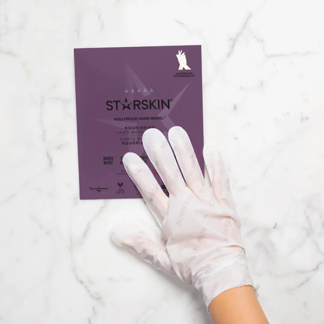 Starskin Hollywood Hand mask gloves being showcased while the product is being used on a hand