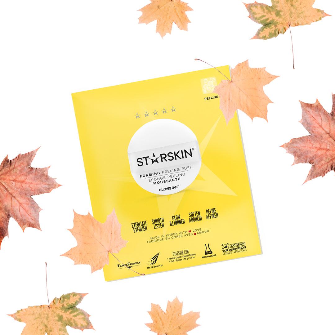 Starskins glowstar foaming peeling puff packaging being displayed. Product is surrounded by  brown leaves. 