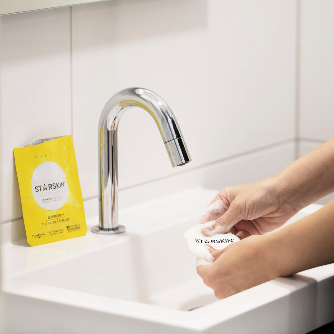 Glowstar being used in a sink with the opened sachet on the sink