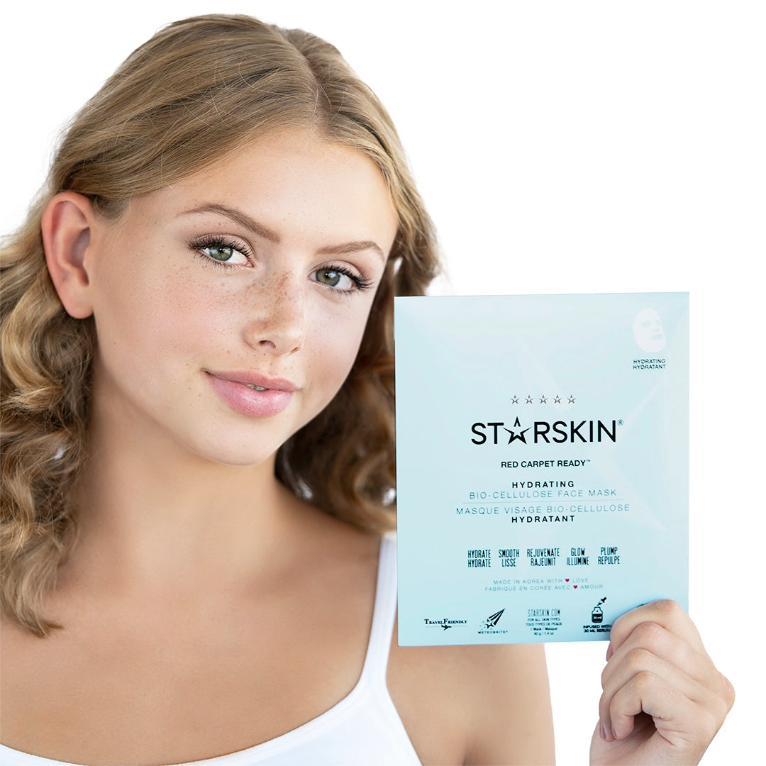 Female holding the Starskin Red Carpet Ready facial mask product in her hand