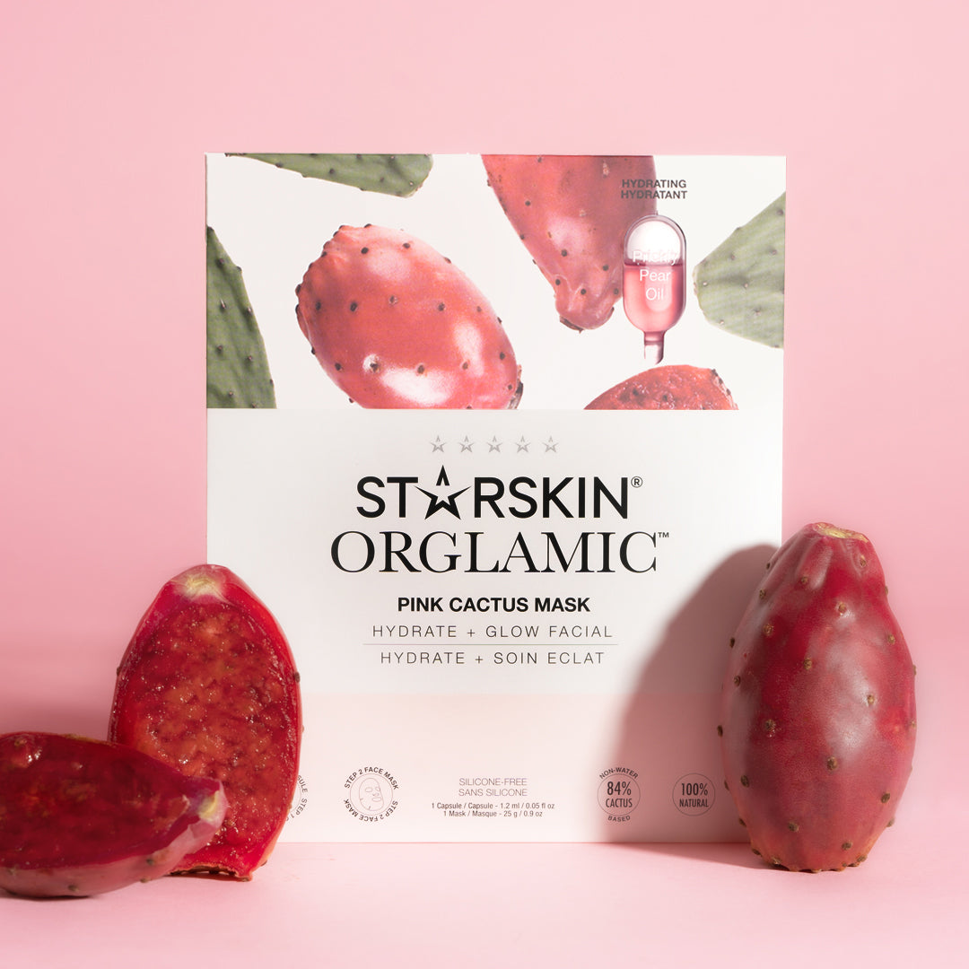 Starskin Pink Cactus Oil Mask product packaging in the middle with a pink background. In front of the product are a couple of pink cactus fruits. 