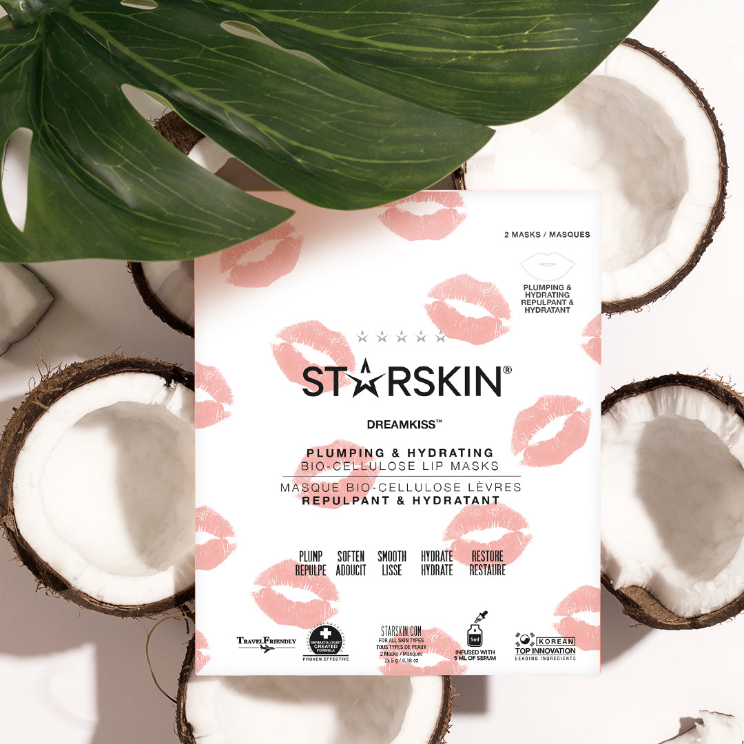 Starskin's dreamkiss packaging being shown. It's placed on a couple of coconuts and a leaf 