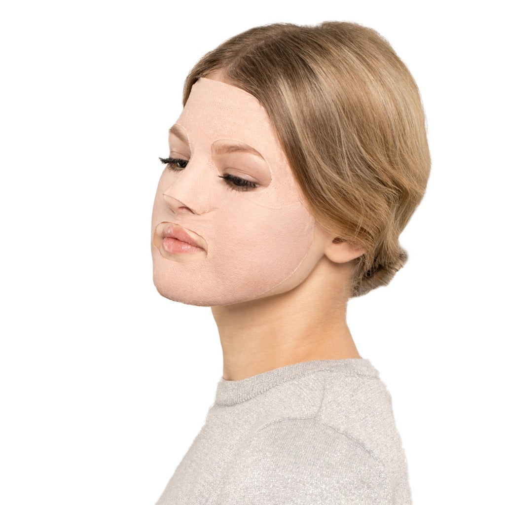 Side profile of a model wearing the STARSKIN Silkmud French Pink Clay on her face