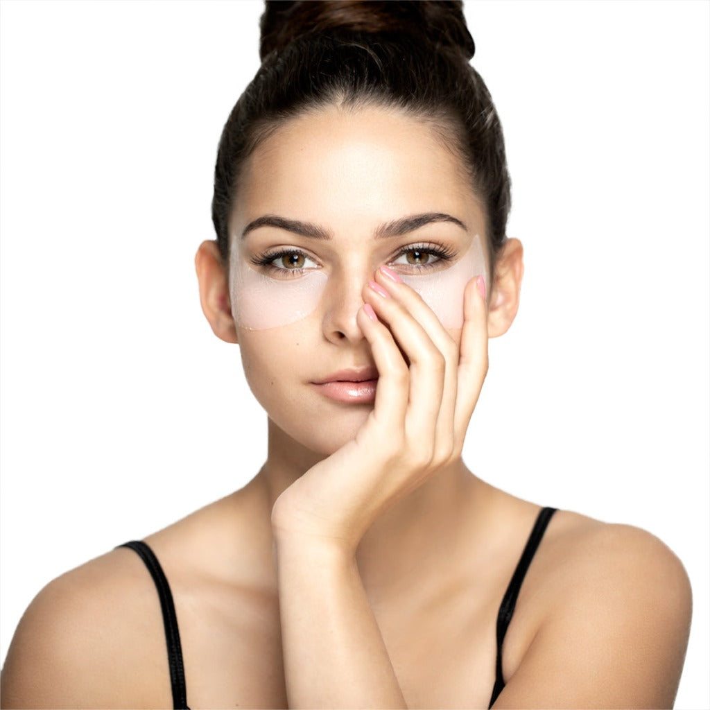 Female model wearing the Eye Catcher masks under her eyes