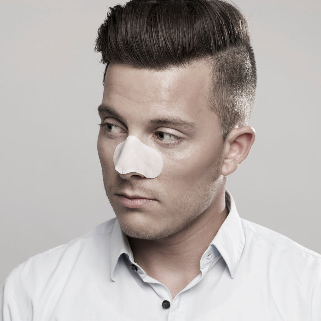 Male model wearing the step one of STARSKIN Sunset Strips - single pack on his nose