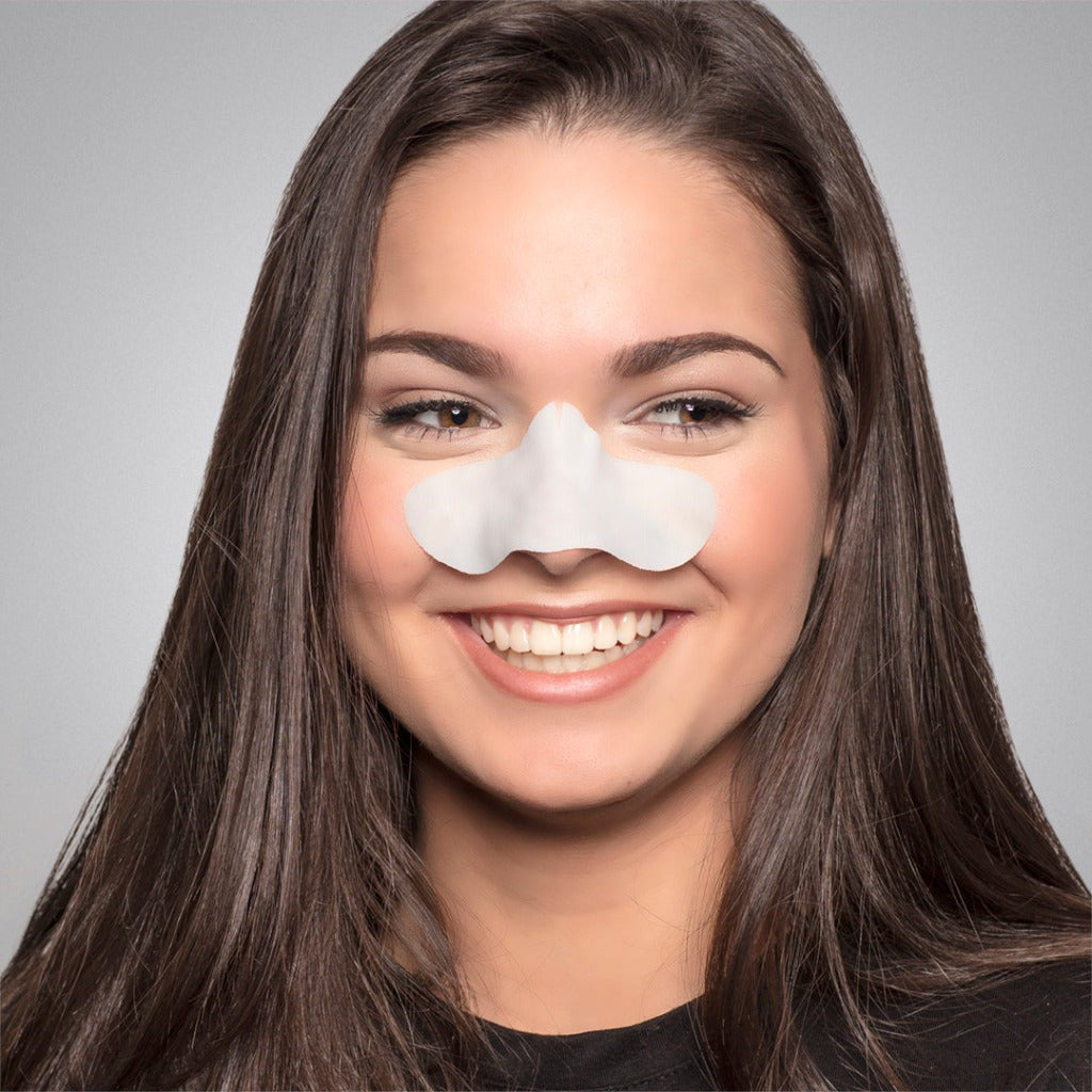 Female model wearing the step one of STARSKIN Sunset Strips - two pack on her nose