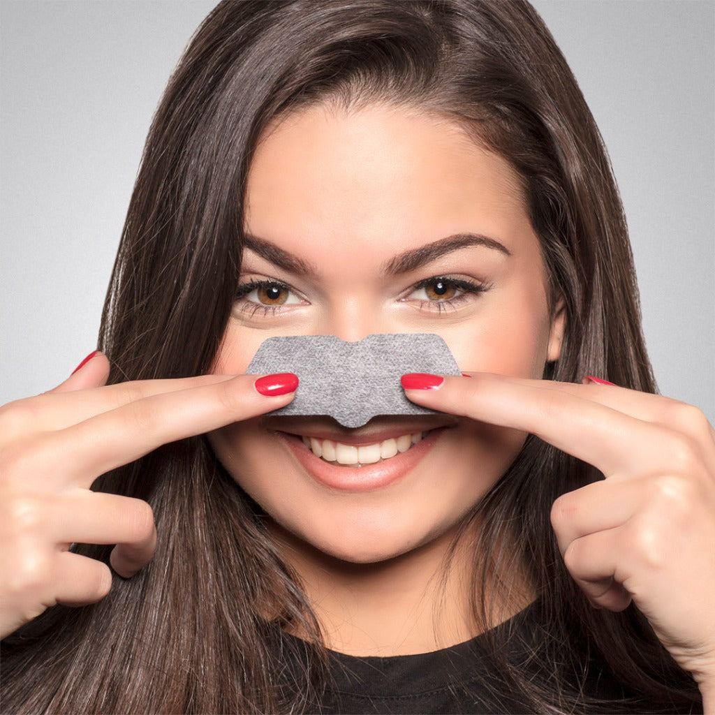 Female model wearing the step two of STARSKIN Sunset Strips - two pack on her nose