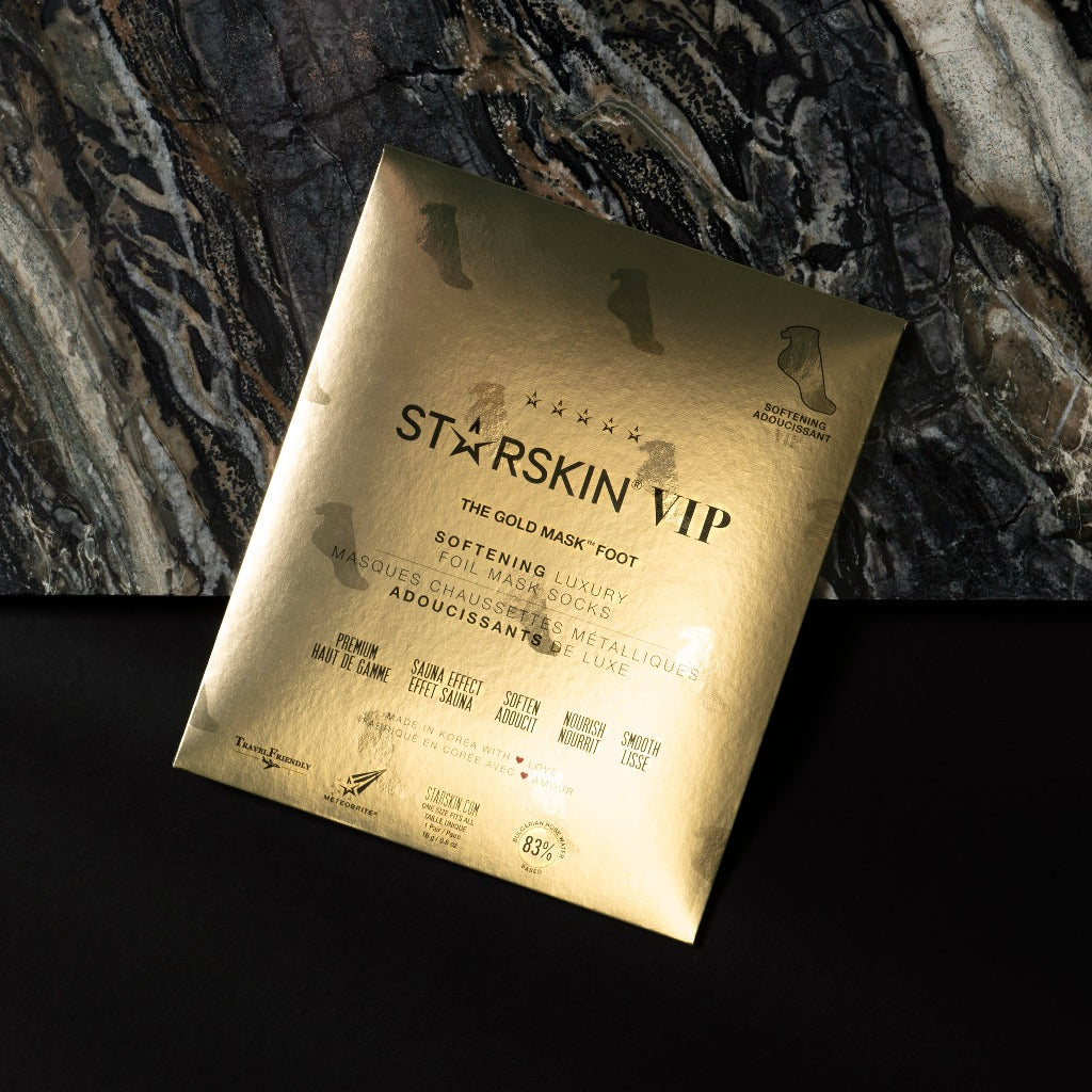 Packaging of Starskin VIP The Gold Mask Foot Laying on a marble background