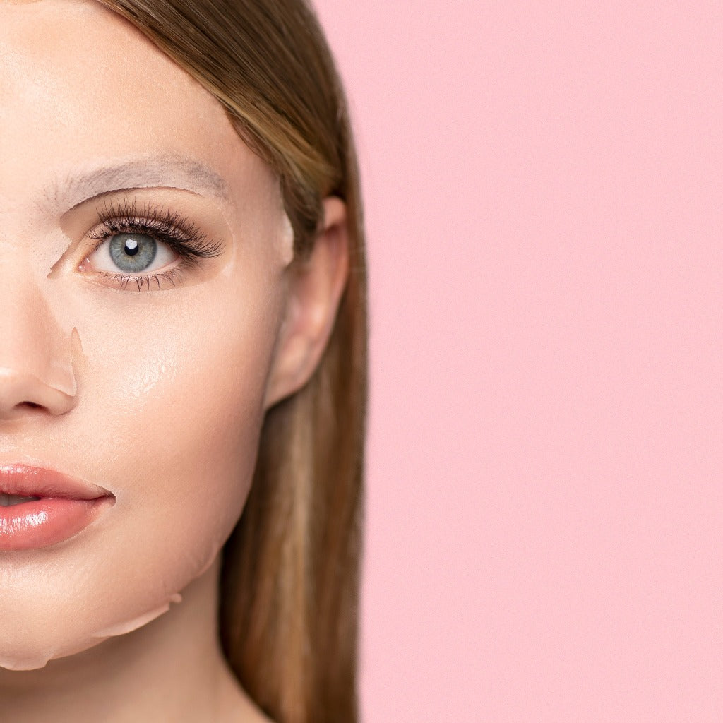 Model with the STARSKIN 100% Camellia mask on her face against a light pink background