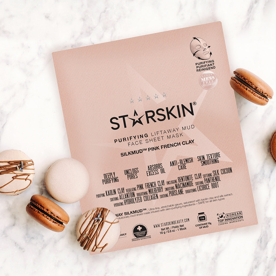 Atmospheric image of the STARSKIN Silkmud French Pink Clay mask with macarons around it