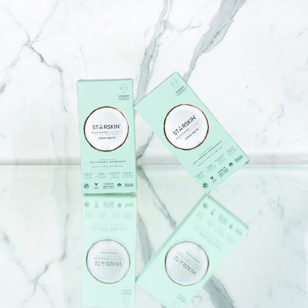 Image with a marble background with two STARSKIN Coco-nuts hair masks visible