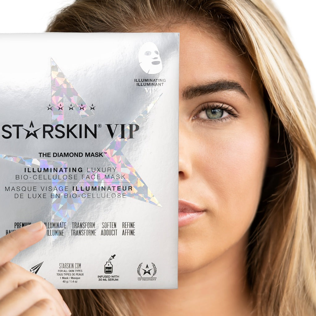 Model holding Starskin VIP The Diamond Mask in front of her face