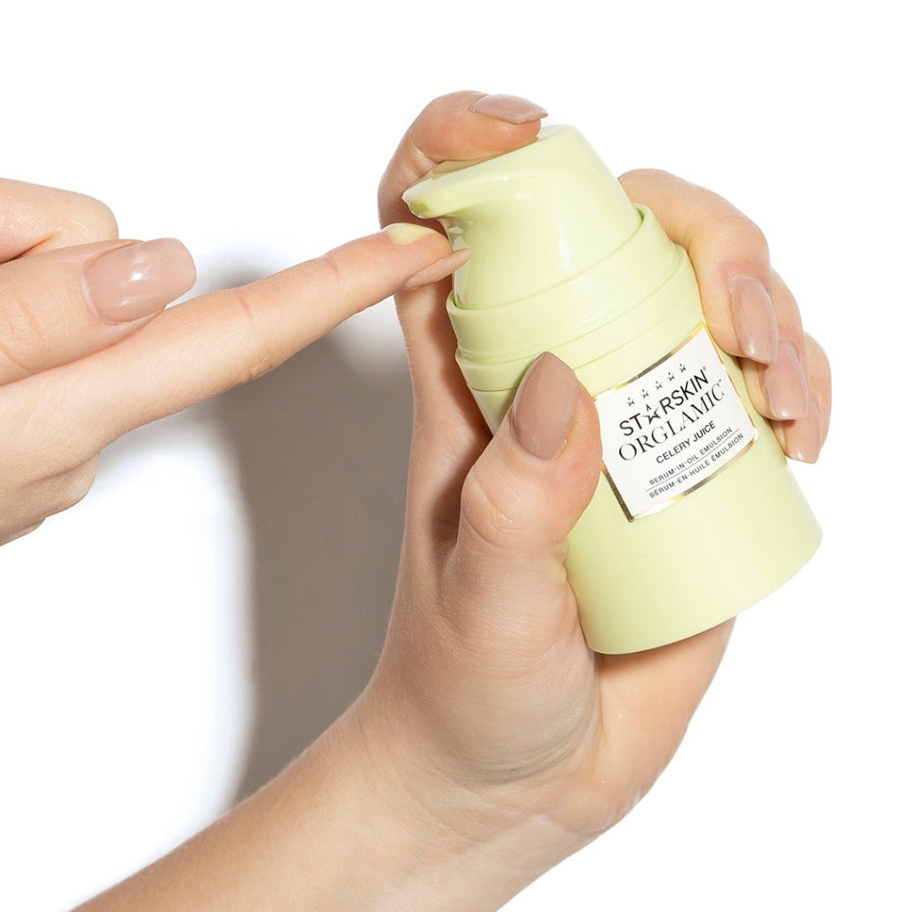 Image of a hand holding the STARSKIN ORGLAMIC Celery Juice Serum-In-Oil Emulsion