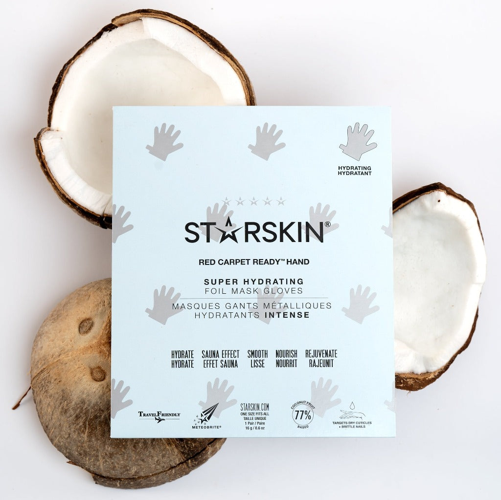Atmospheric image of the STARSKIN Red Carpet Ready Hand mask laying on top of three coconuts